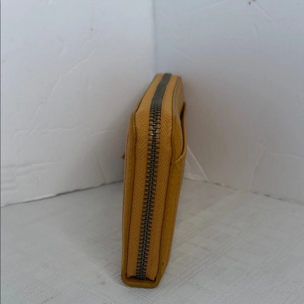 Margot Anna Zip Around Leather Wallet in marigold yellow.